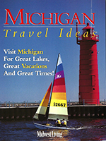 Cover of Michigan Travel Ideas with photo of a sailboat floating past a red lighthouse. Link to PDF